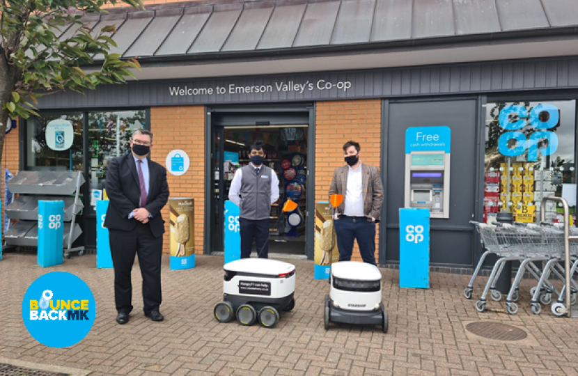 Iain with the delivery robots, Sat (Co-op) and Andy (Starship Technologies)