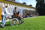 Child in a wheelchair playing at school